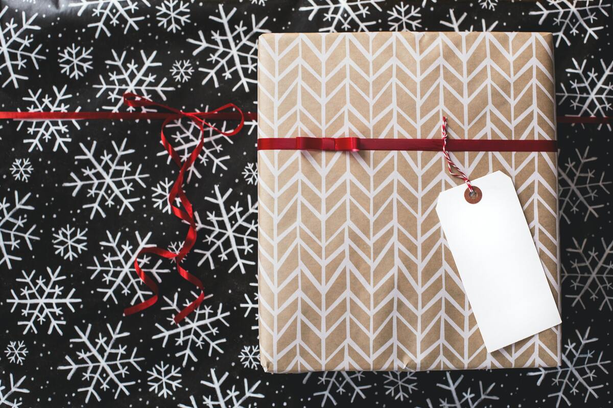 Most shiny and glittery wrapping paper cannot be recycled. Use brown recyclable paper and cloth ribbons instead.