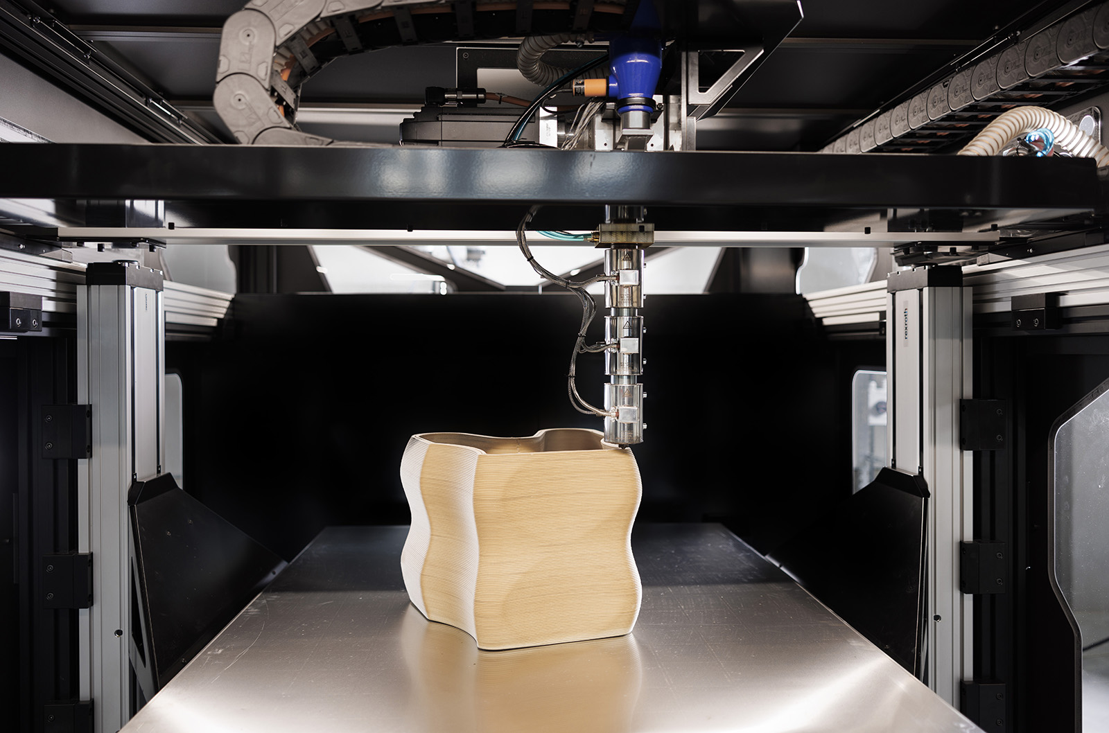 Large-scale 3D printers for additive manufacturing: design considerations  and challenges